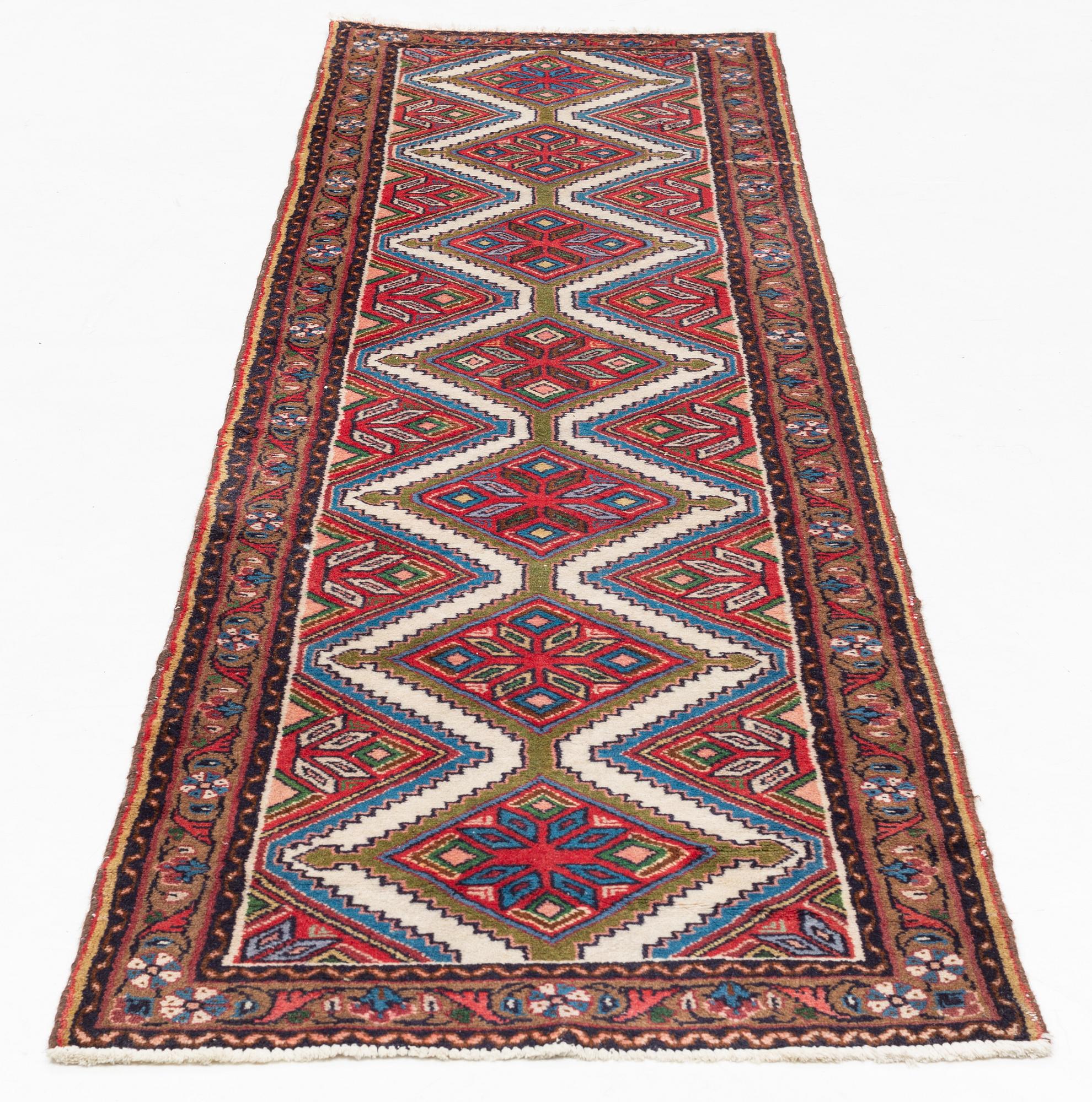 An oriental runner, c. 280 x 75-79 cm.
