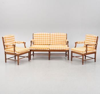 A pair of chairs and a sofa, first half of the 20th Century.