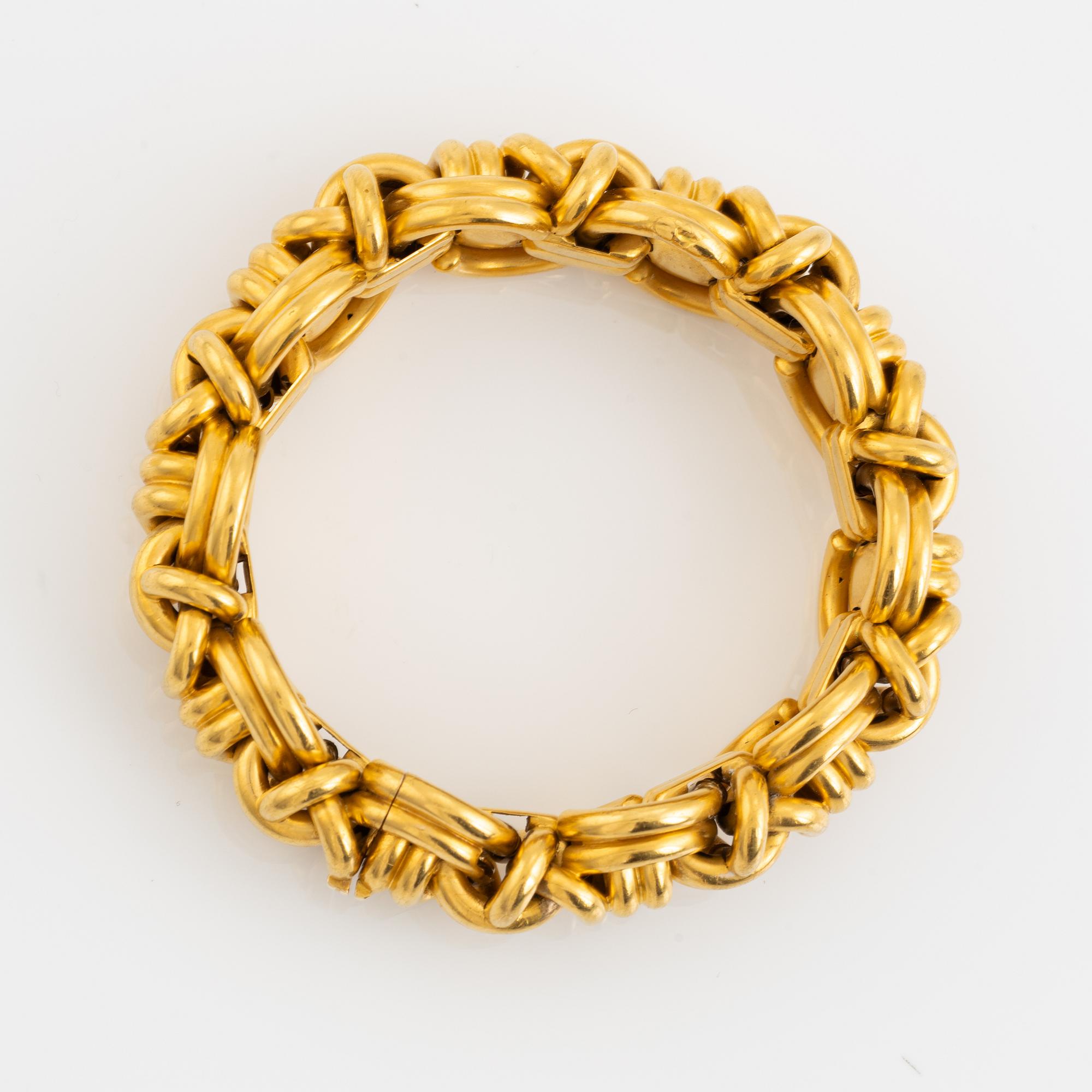 An 18K gold bracelet.