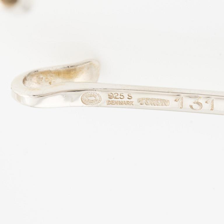 Vivianna Torun Bülow-Hübe, a neck ring no. 160 with pendant no. 131 in rutilated quartz, sterling silver, for Georg Jensen, Denmark.