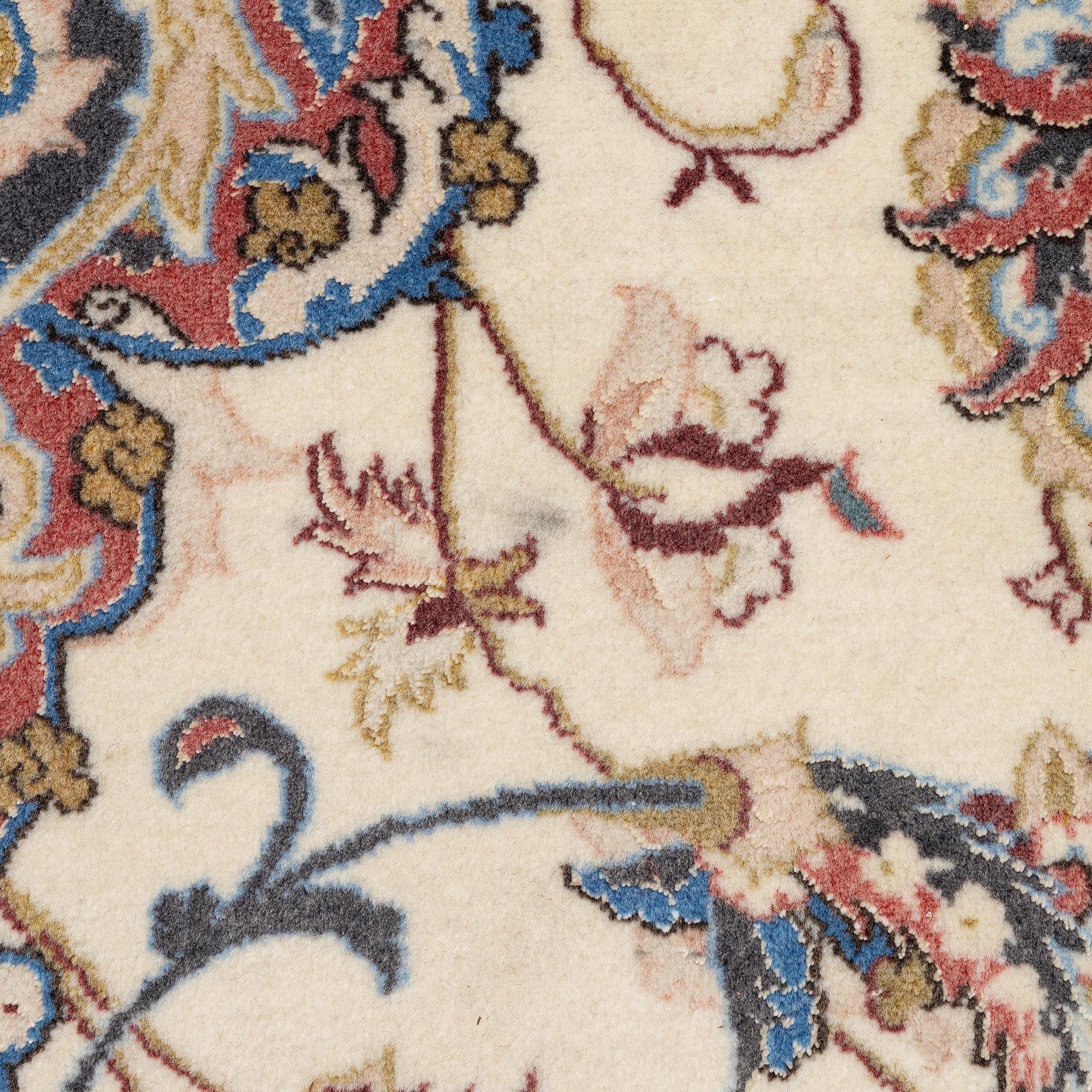 An Isfahan carpet, signed, approx. 372 x 255 cm.