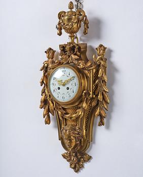 A French  Louis XVI-style wall clock, around 1900.