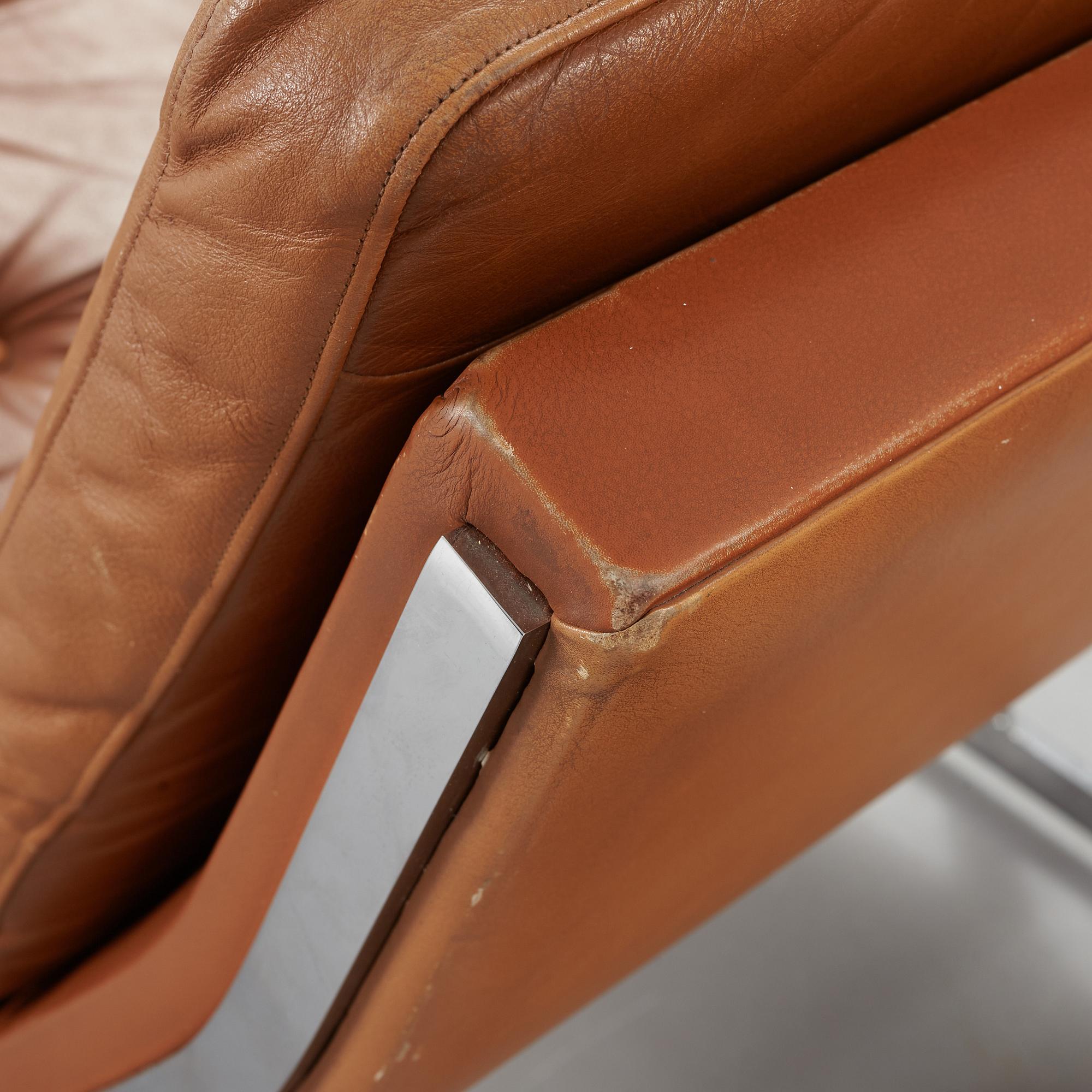 A pair of Poul Nørreklit chromed steel and brown leather easy chairs, Selectform, Denmark 1960's.