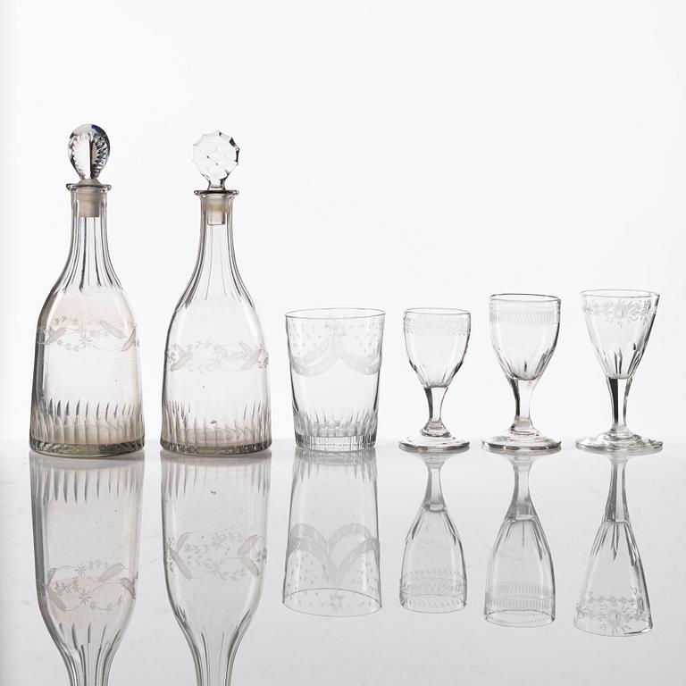 A set of two glass decanters and nine glasses, circa 1800/ early 19th Century.