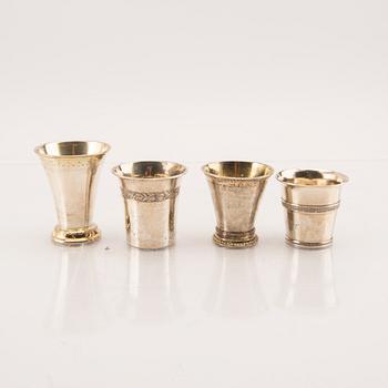 A set of four 19th/20th century silver beakers weight 207 grams.