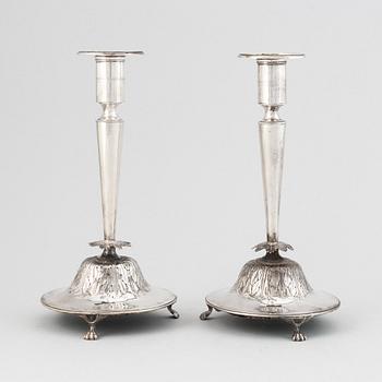 A pair of Swedish Empire silver candlesticks, mark of Gustaf Folcker, Stockholm 1826.