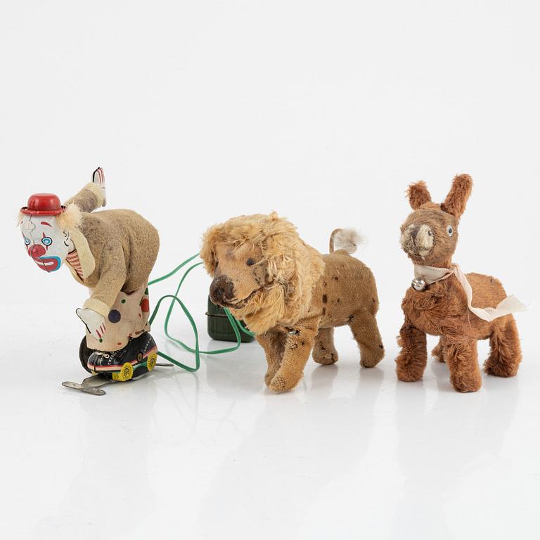 A set of five toys, including 'Rolly' clown from Schuco, 20th century.
