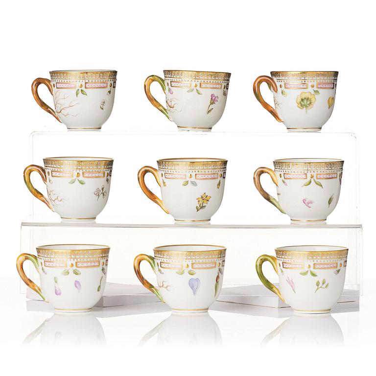 A set of nine Royal Copenhagen 'Flora Danica' cups with saucers, Denmark, 20th century.
