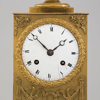 AN EMPIRE MANTEL CLOCK, first half of the 19th century.