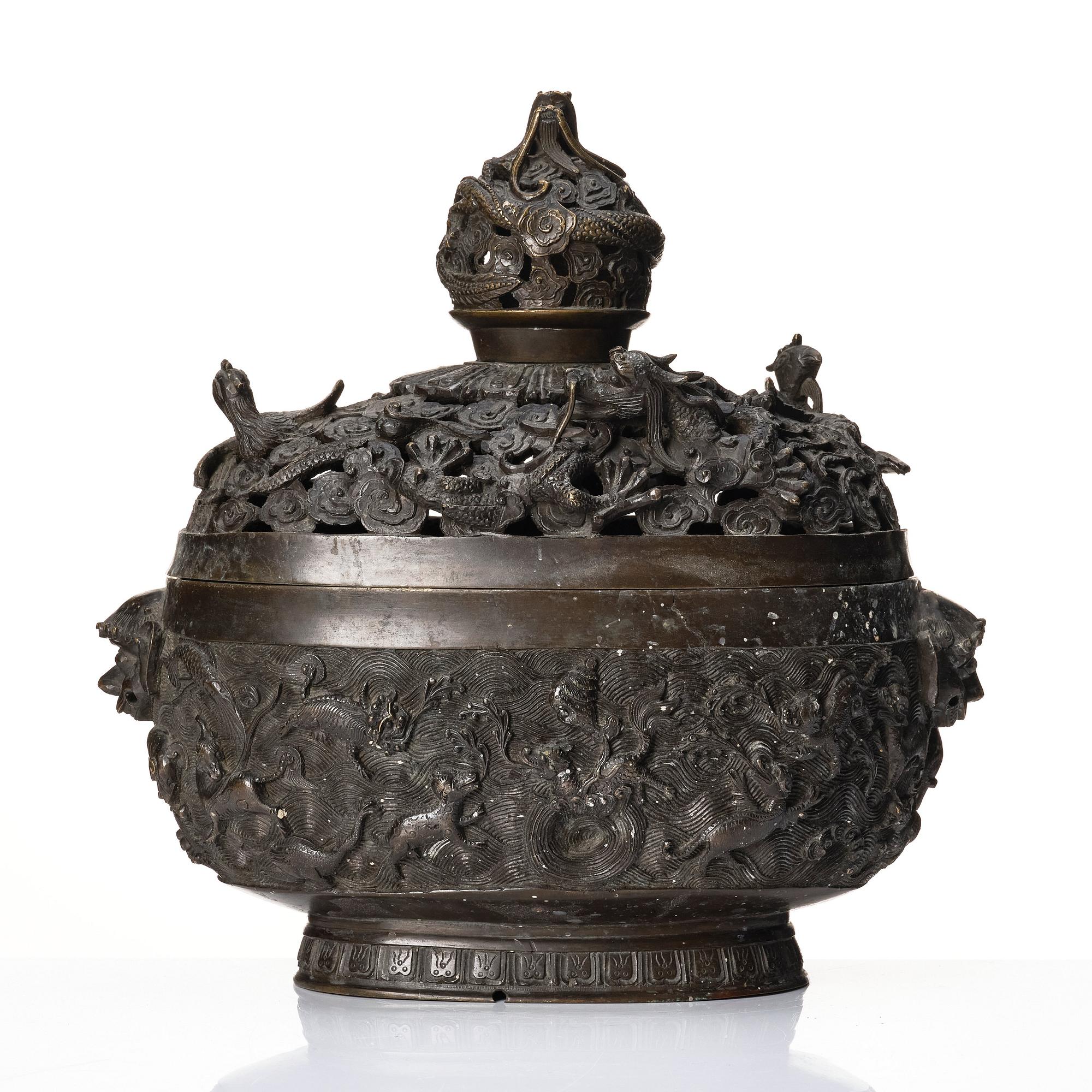 A bronze reticulated incense burner with cover, Qing dynasty (1644-1912).