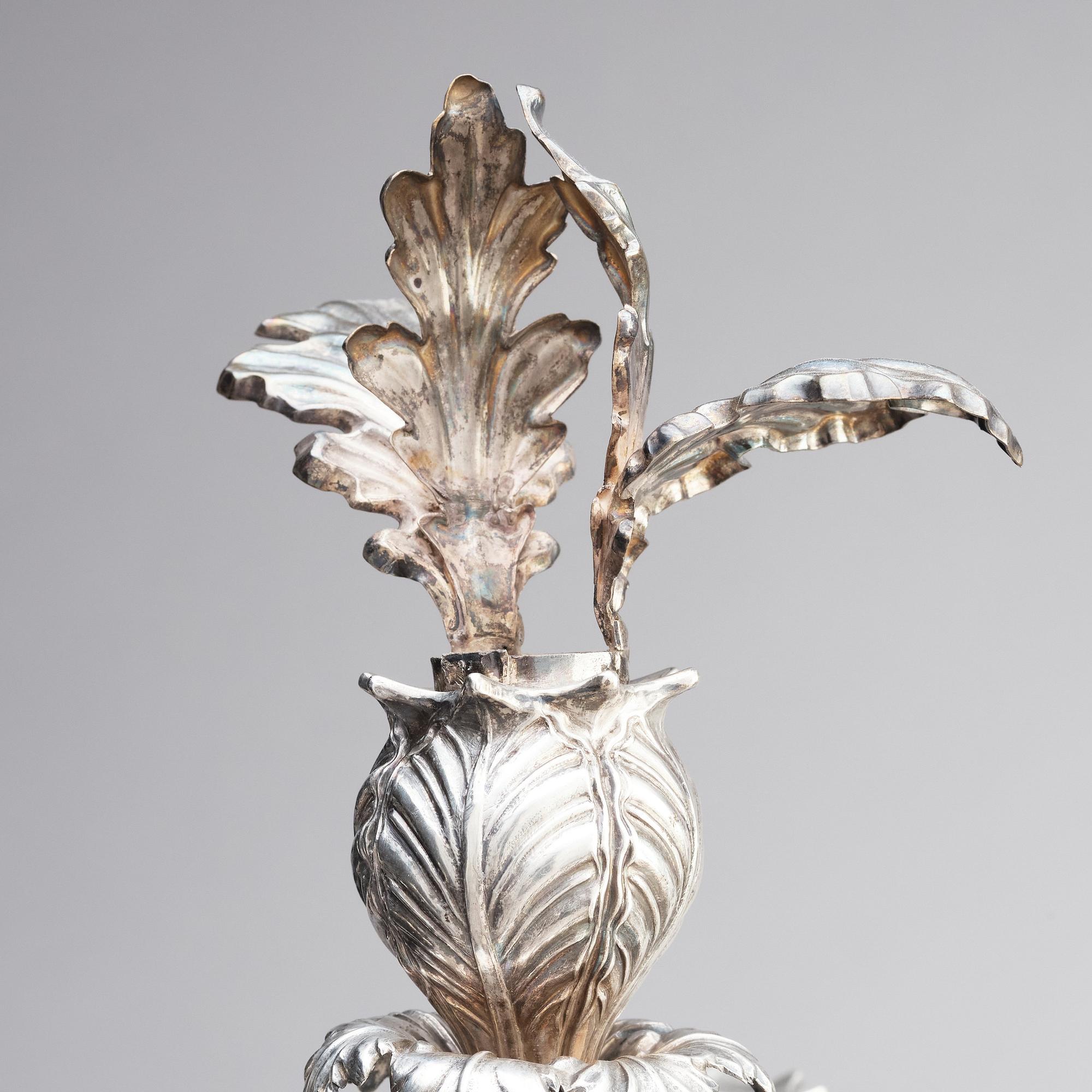 A pair of Swedish mid 19th century silver candelabra, marks of Gustaf Möllenborg, Stockholm 1844.