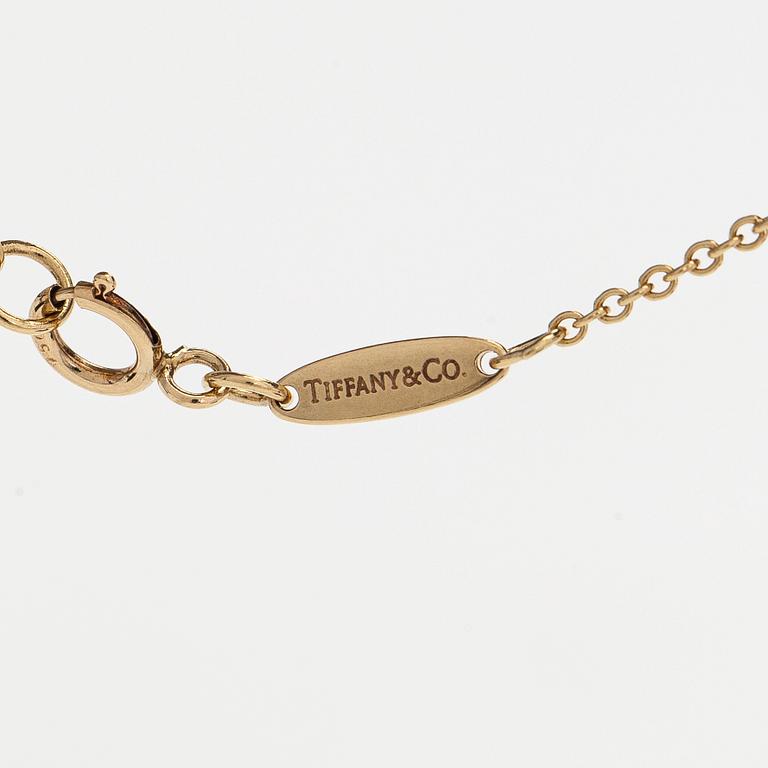 Tiffany & Co, Elsa Peretti, an 18K gold "Open Heart" necklace.