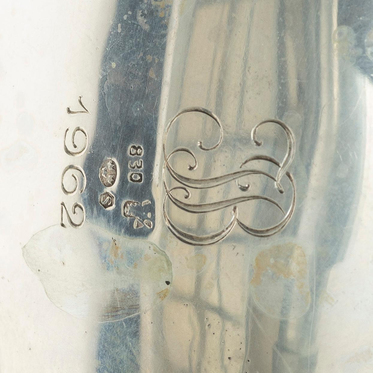 A silver sugar bowl, creamer and sugar tongs, 20th century.