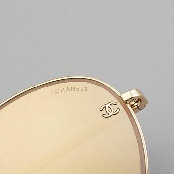 Sunglasses by Chanel.