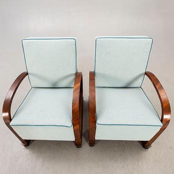 A pair of Art deco walnut armchairs first half of the 20th century.