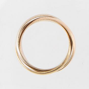 An 18K tri-coloured "Trinity" gold ring by Cartier.