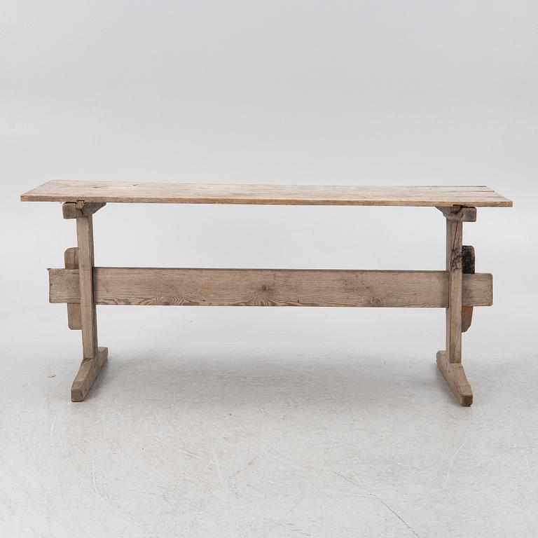 A wooden table, circa 1900.