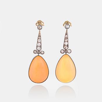 1097. A pair of opal earrings set with old-cut diamonds.