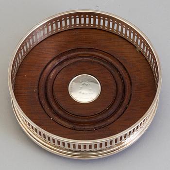 Six mahogany and sterling silver coasters, Carrs of Sheffield, Shefield, England 2003.