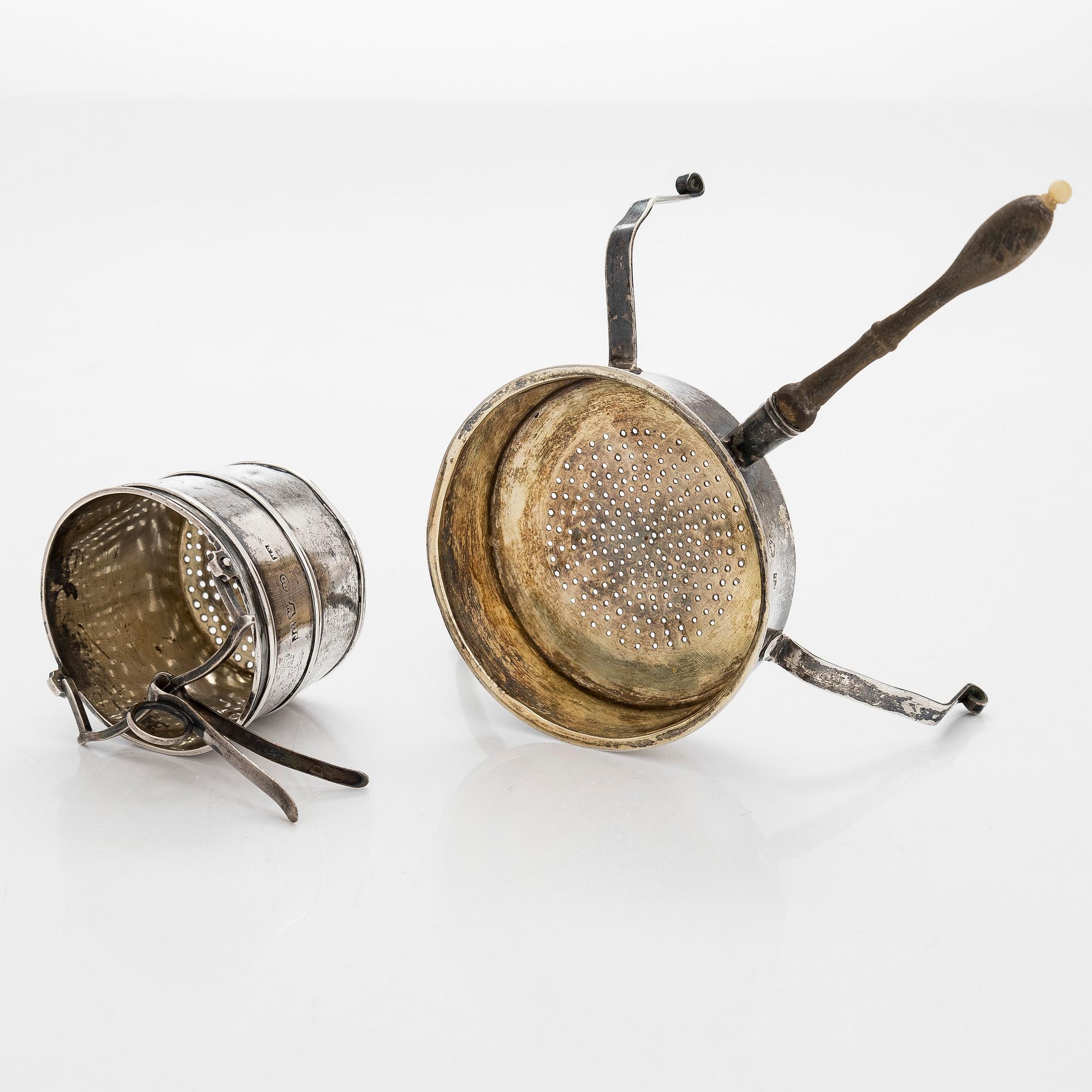 A silver sugar bowl, R. Mellin, Helsinki 1860, and two tea strainers, Kuopio and Porvoo, first half of the 19th century.