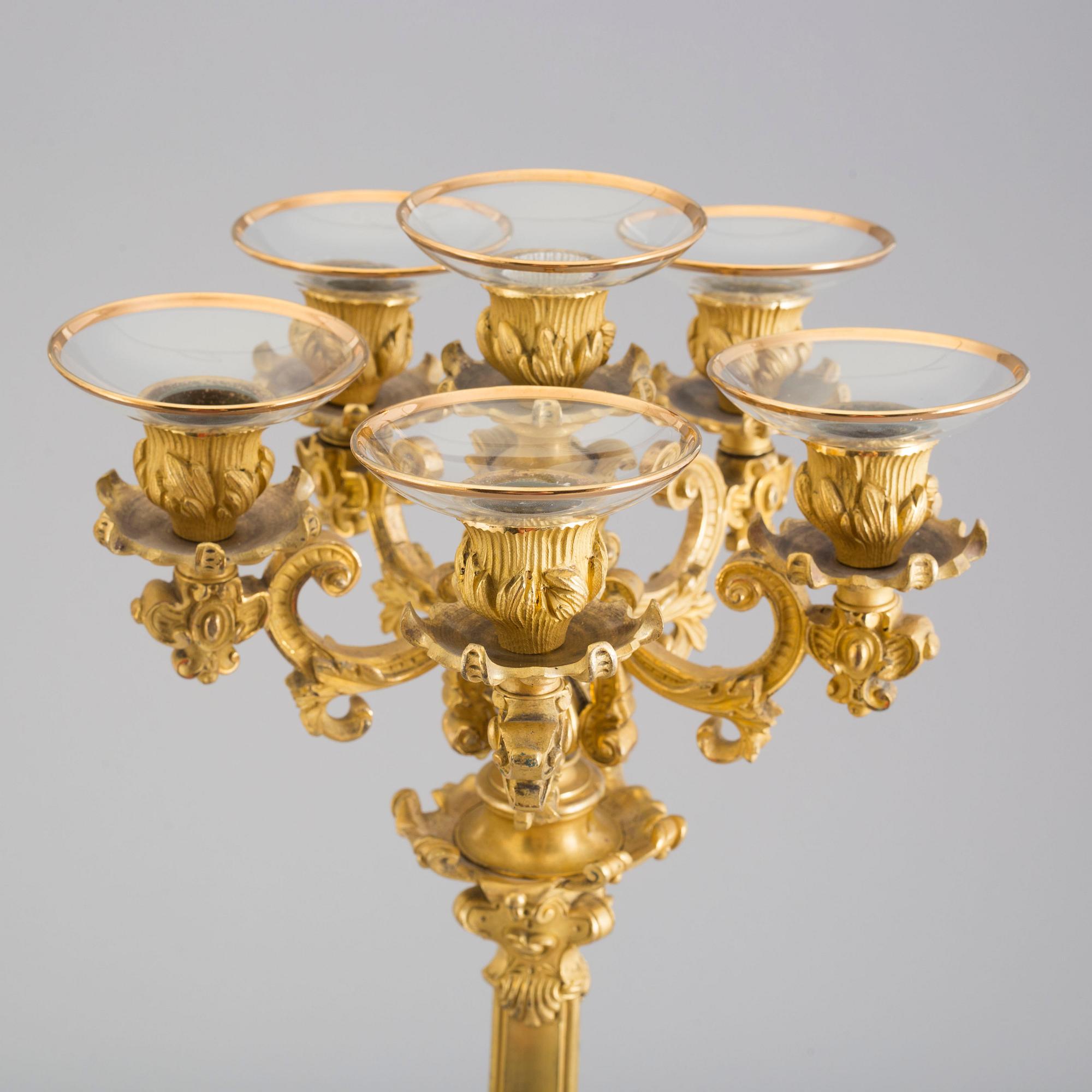 A pair of early 20th century bronze candelabras.