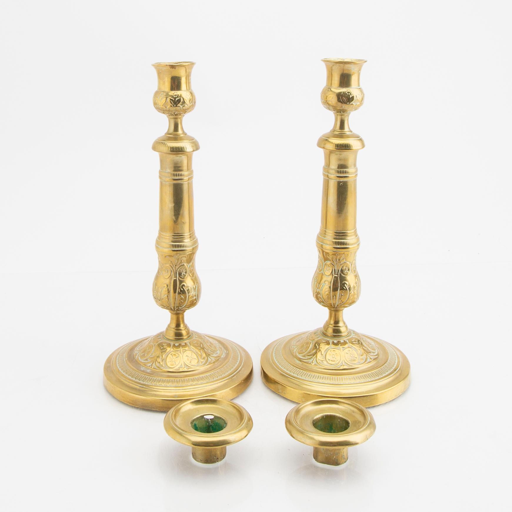 A pair of 19th century brass candle sticks.