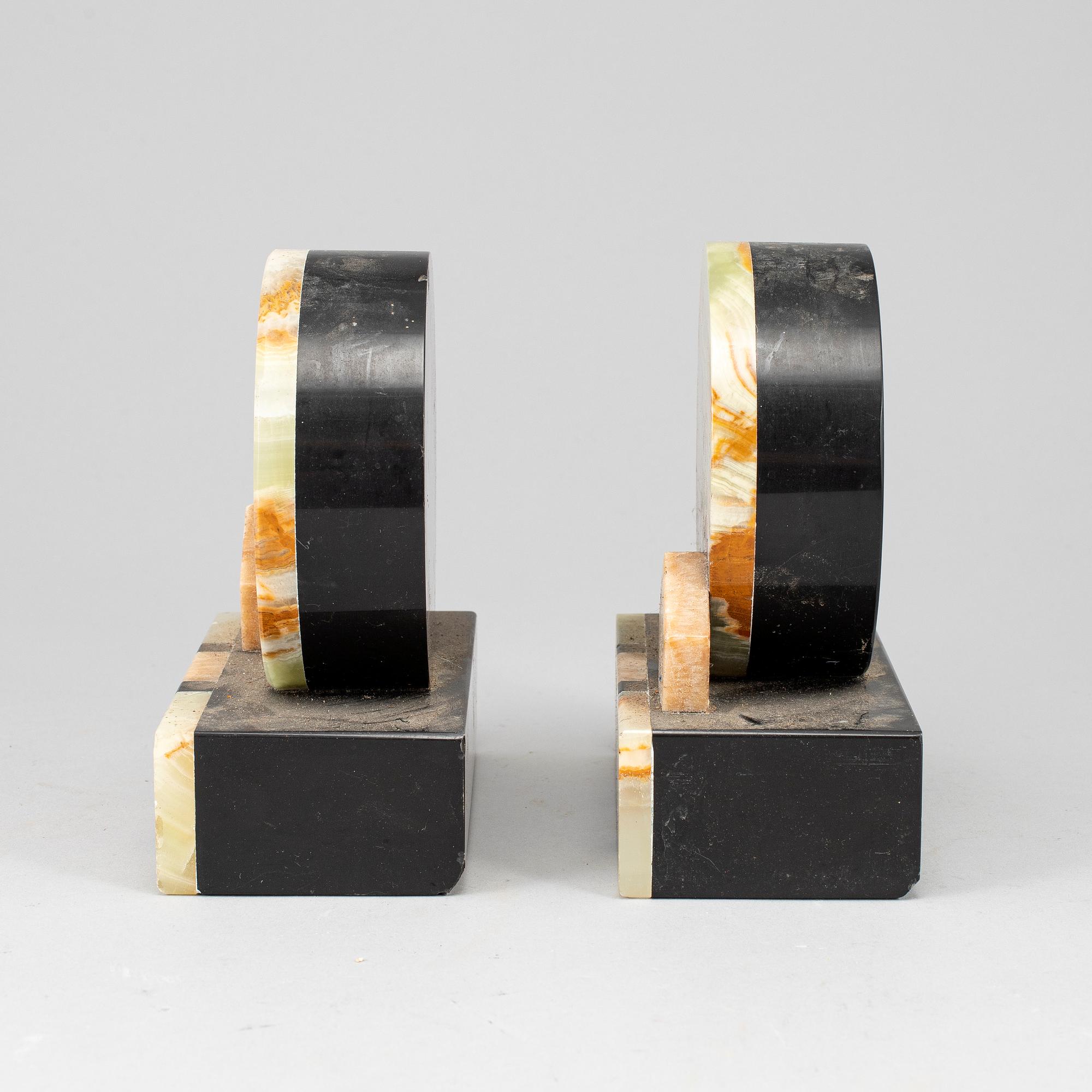A pair of art déco onyx and marble book ends, 1930s.