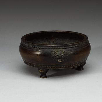 A bronze tripod censer, Qing dynasty (1644-1912), with Xuande six character mark.