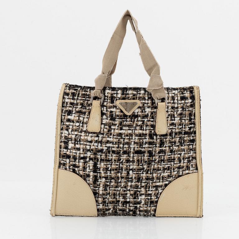 Prada, a tweed and leather bag.