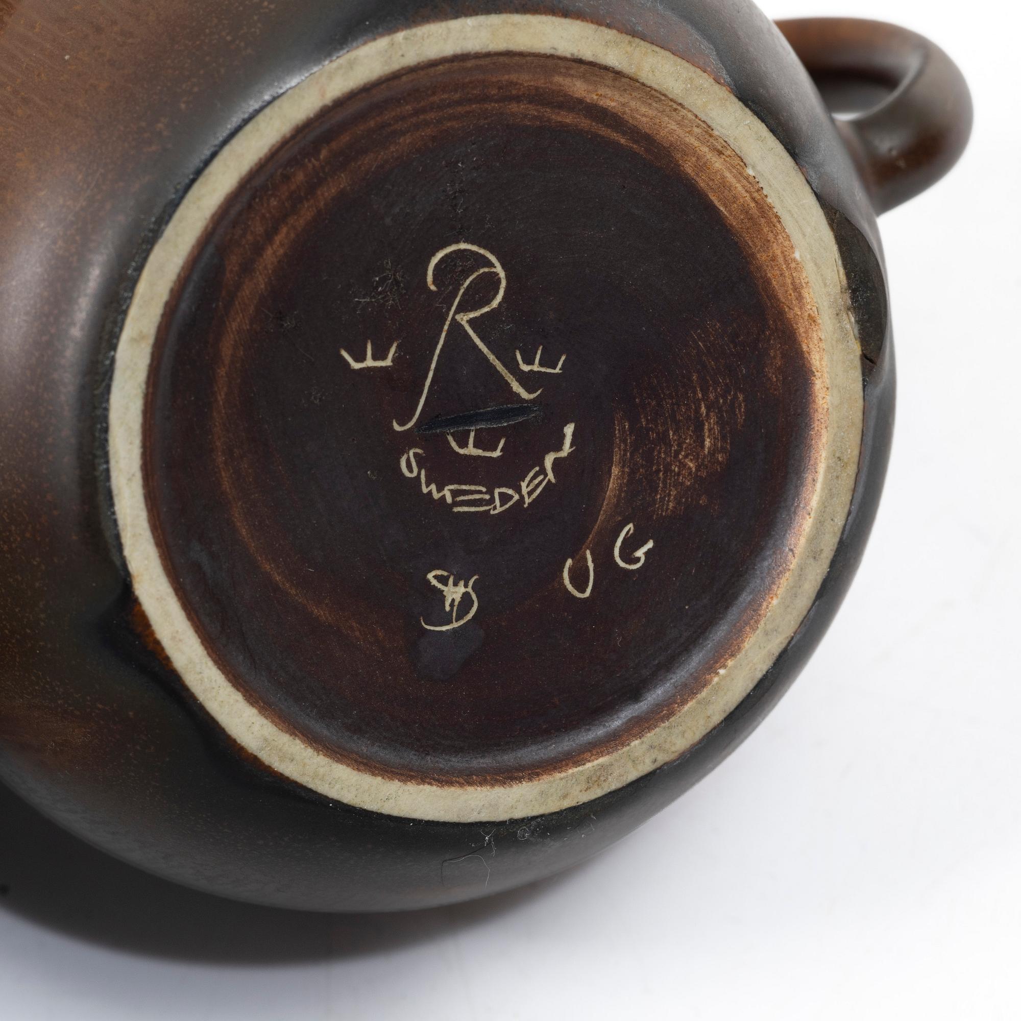 Gösta Grähs, , Gunnar Nylund and Carl-Harry Stålhane, three stoneware teapots, Rörstrand.