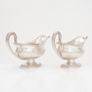 A pair of sterling silver sauce jugs, maker's mark of Andrew Fogelberg, London 1774.