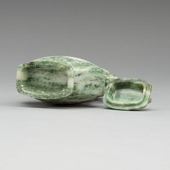 A Chinese archaistic green stone vase with cover, 20th Century.