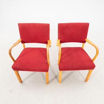 A pair of 1940s armchairs.