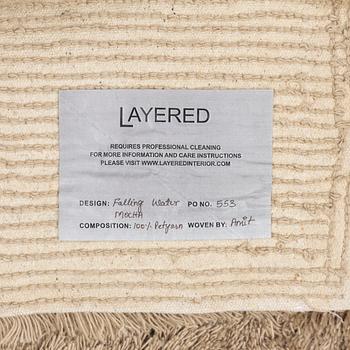 A monochrome carpet, 'Fallingwater - Mocha' by Layered, ca 400 x 300 cm.