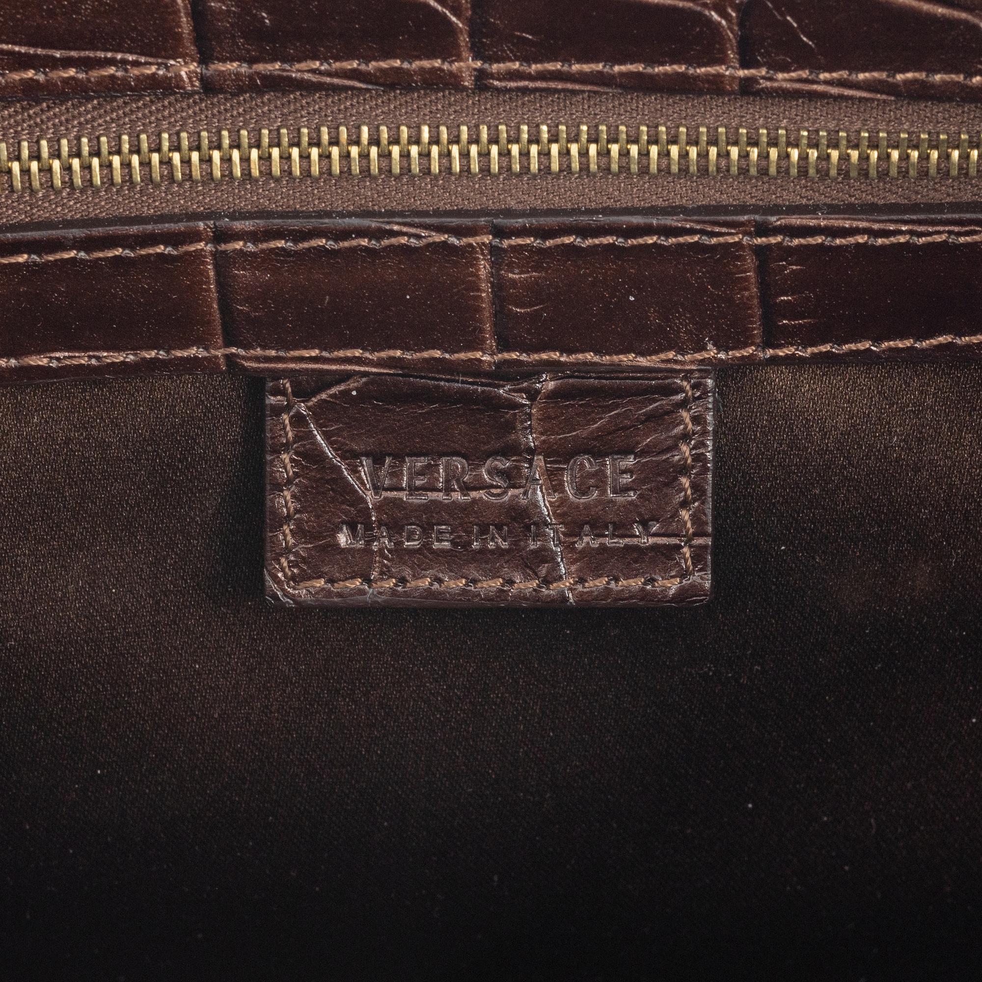 Versace, a bronze metallic leather handbag.