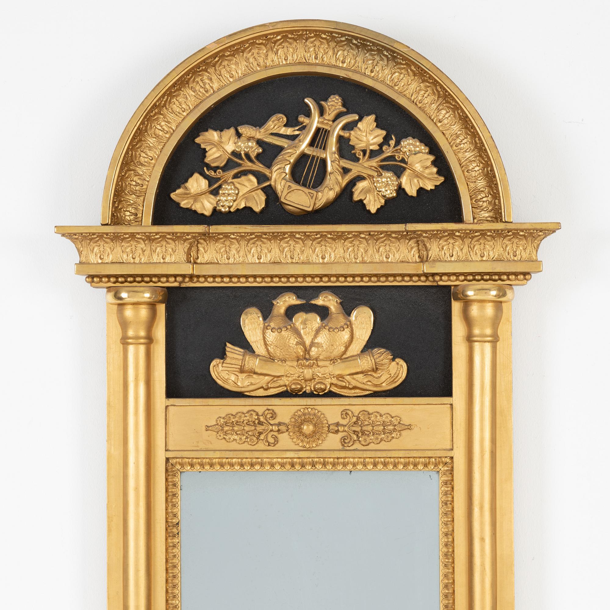 A Swedish Empire mirror, first half of the 19th Century.