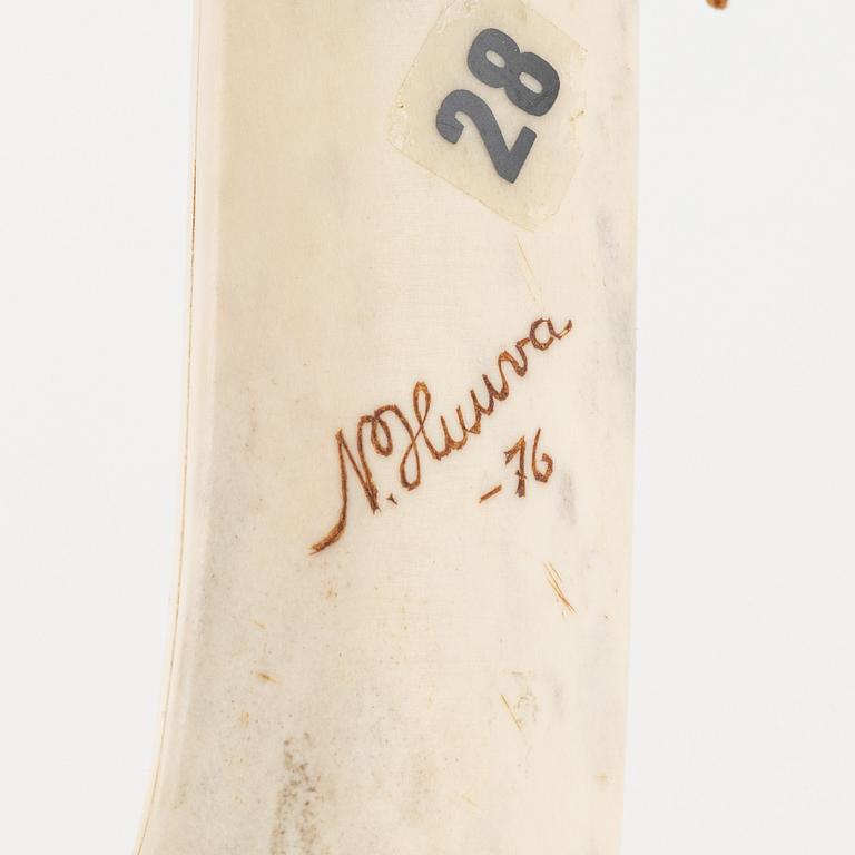 Nils Huuva, a reindeer horn knife, signed and dated -76.
