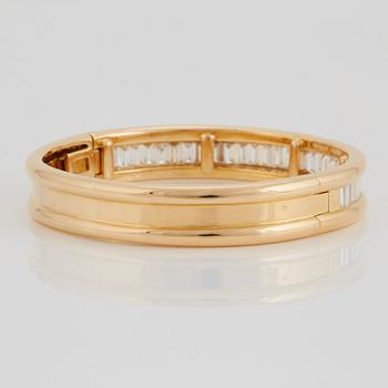 An 18K gold bracelet set with baguette-cut diamonds 7.715 cts according to engraving.