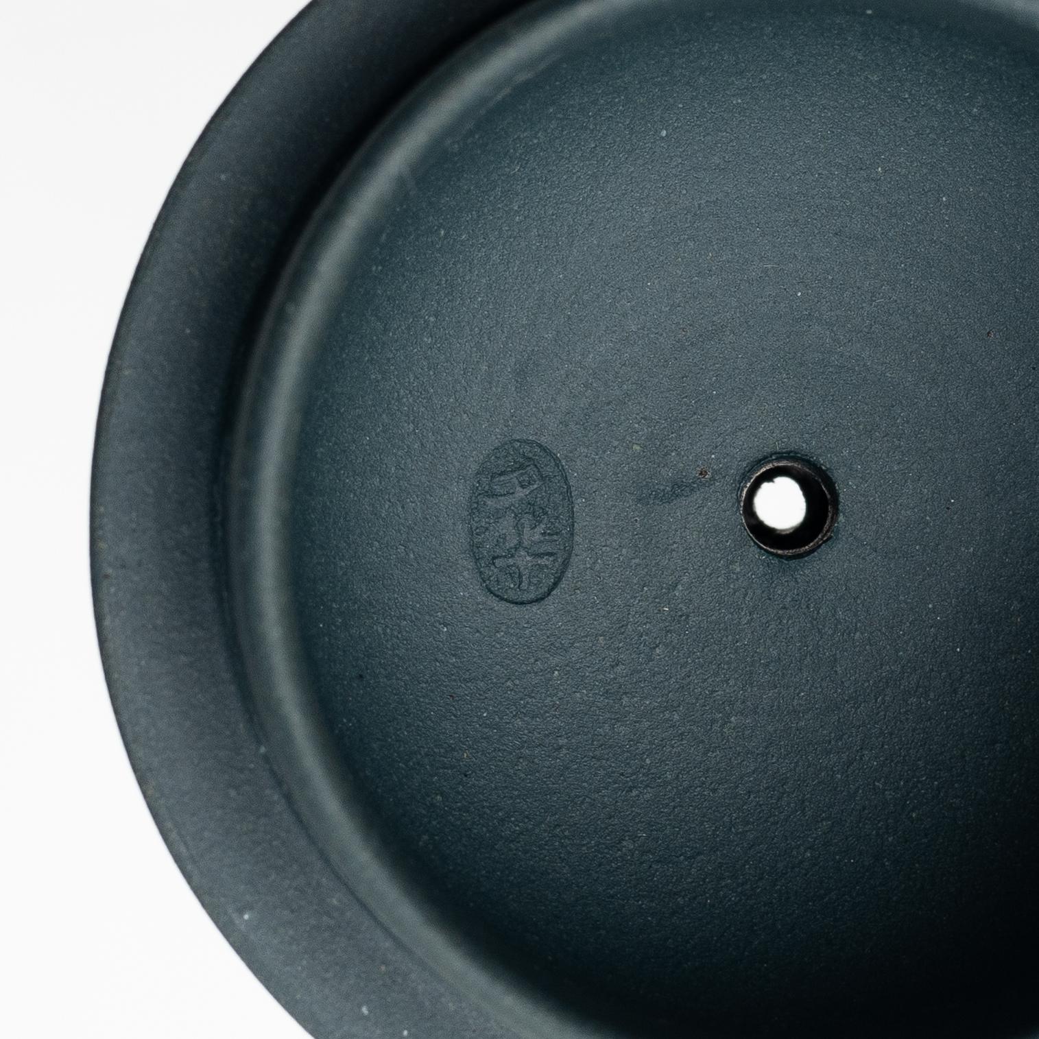 A group of three yixing teapots and a box with cover, China, 1970/80s.