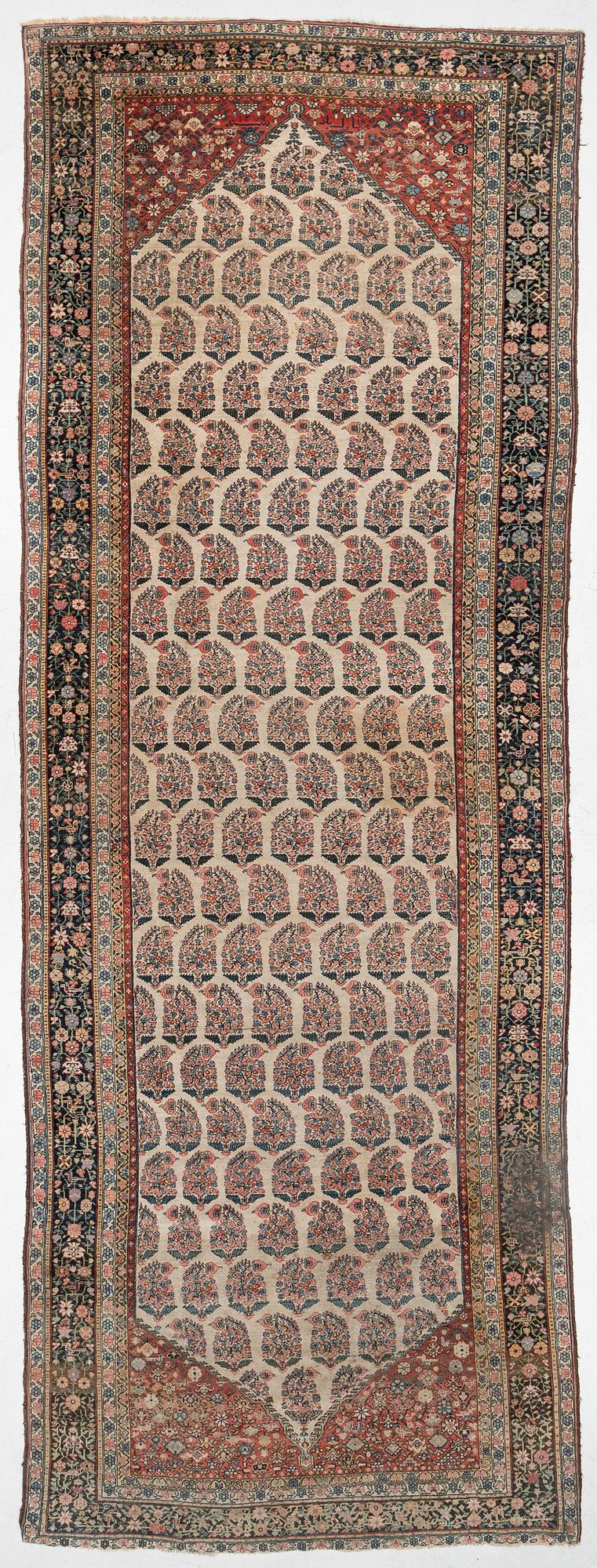 A Bakhtiari carpet, signed, c. 580 x 212 cm.