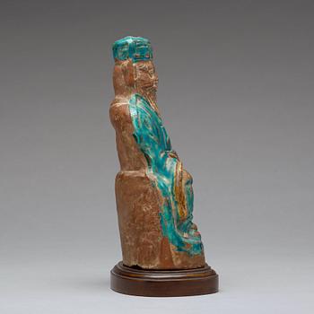 A turqoise glazed figure of a deity, Ming dynasty, 17th century.