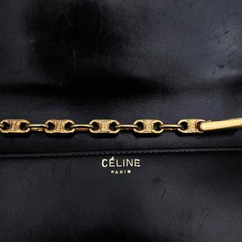 CÉLINE, a black leather evening bag.