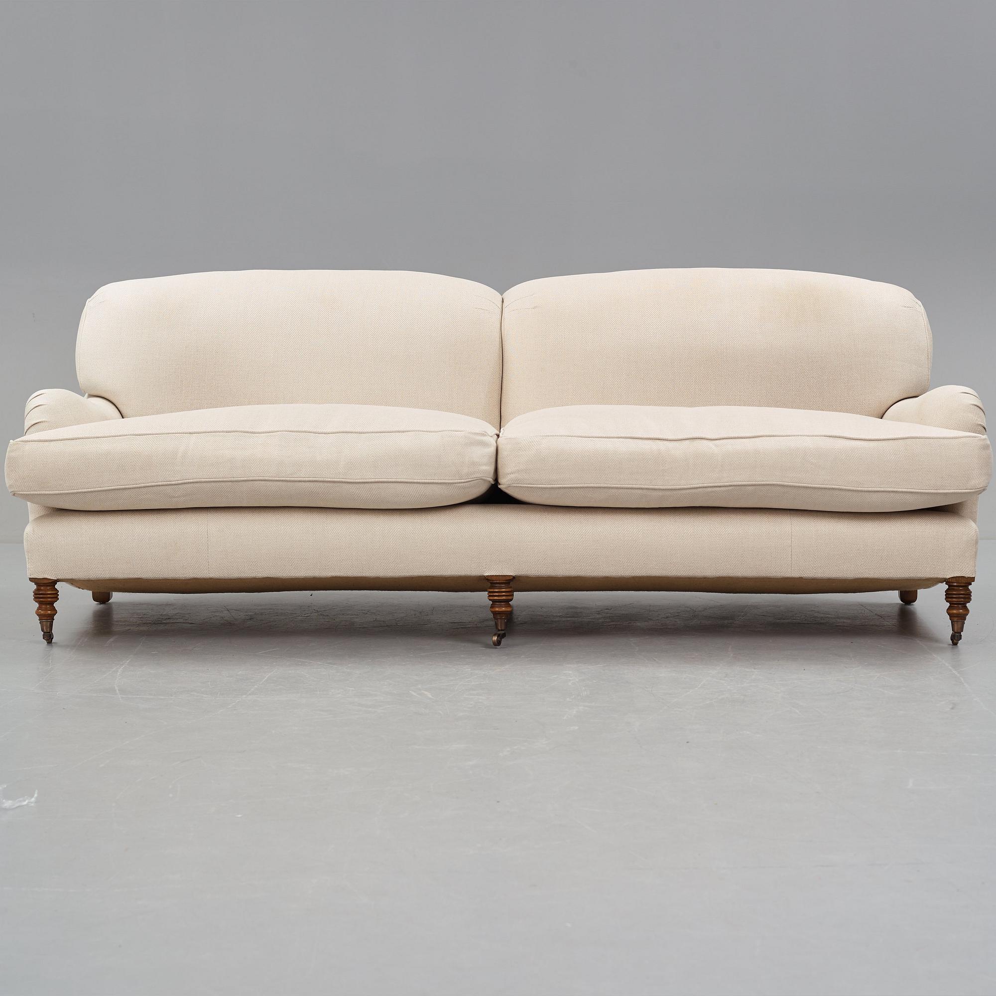 SOFA, "Howard", upholstered in an off-white fabric.