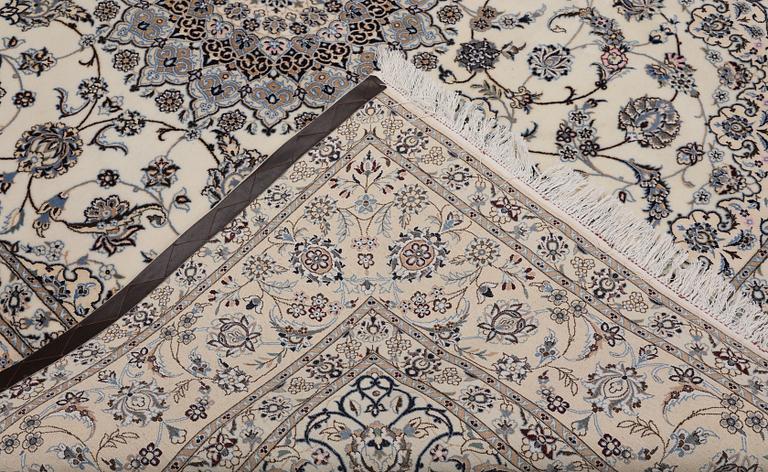 A Nain part silk carpet, 269 x 213 cm.