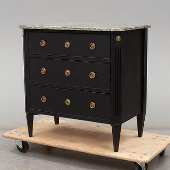 a gustavian style chest of drawers from the early 20th century.