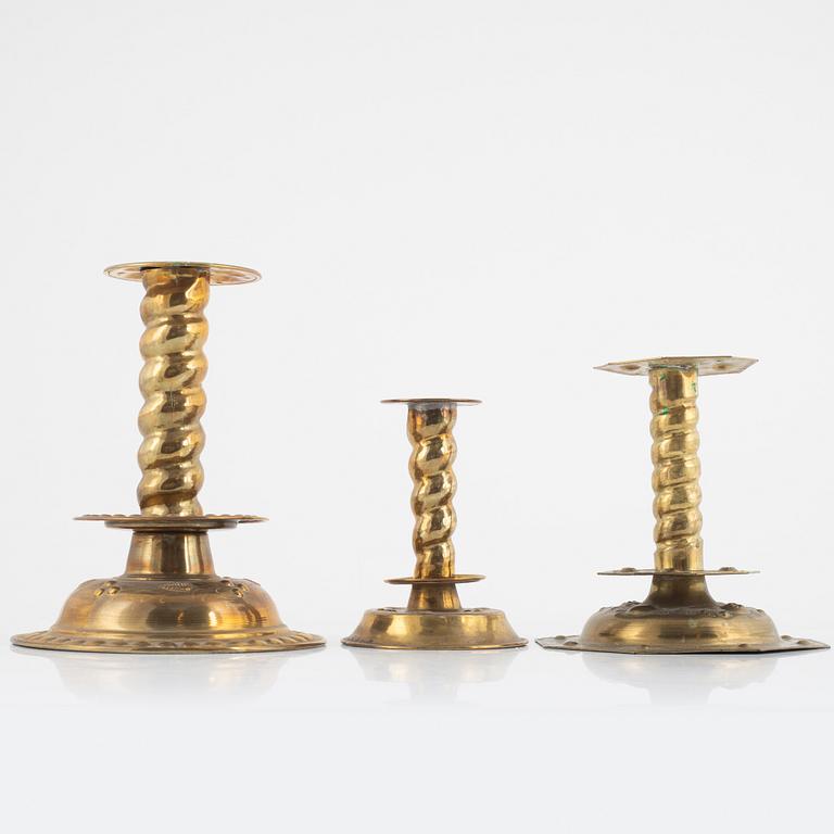 Three pair of brass Baroque style candlesticks, around 1900.