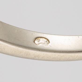 Ring in 18K white gold set with five old-cut diamonds.