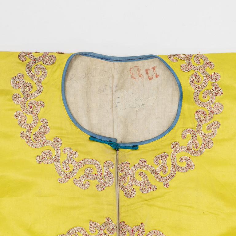 A yellow-ground embroidered silk robe, 20th century.