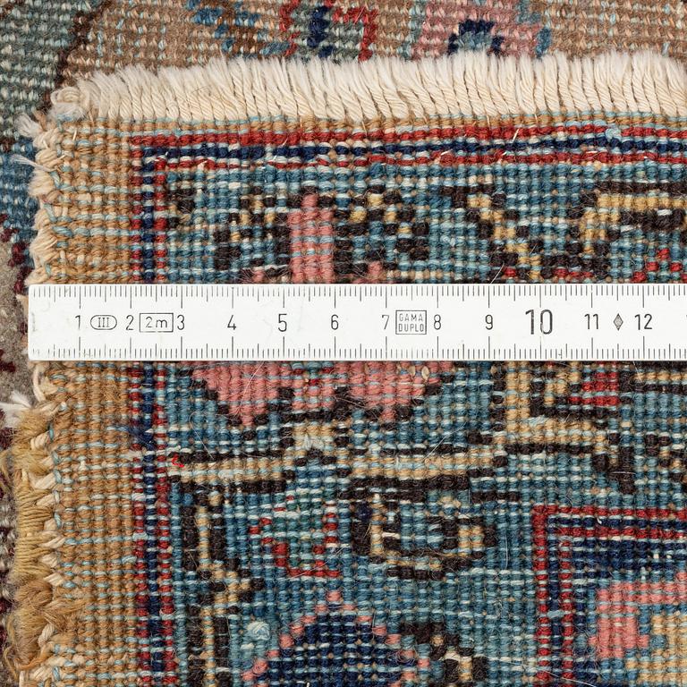 An oriental carpet, circa 350 x 295 cm.