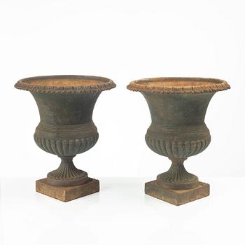 Garden urns, a pair, cast iron, marked No 15, 20th Century.